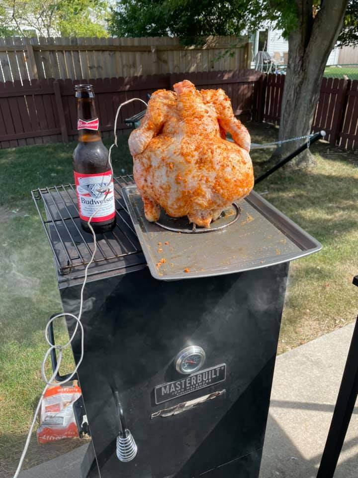 beer can chicken smoker with rub on it