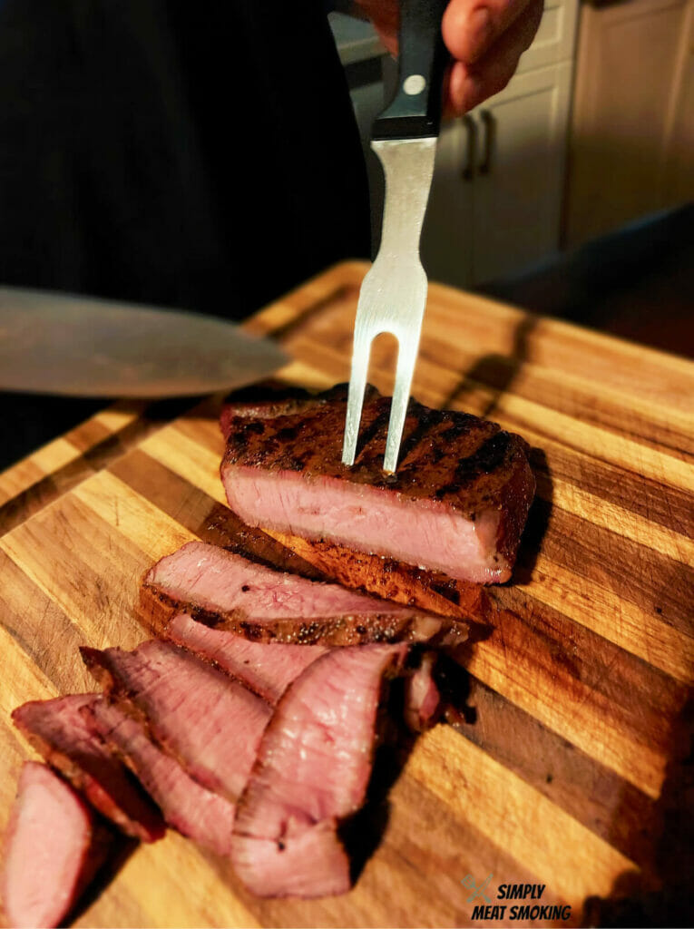 cutting-smoked-sirloin-steak