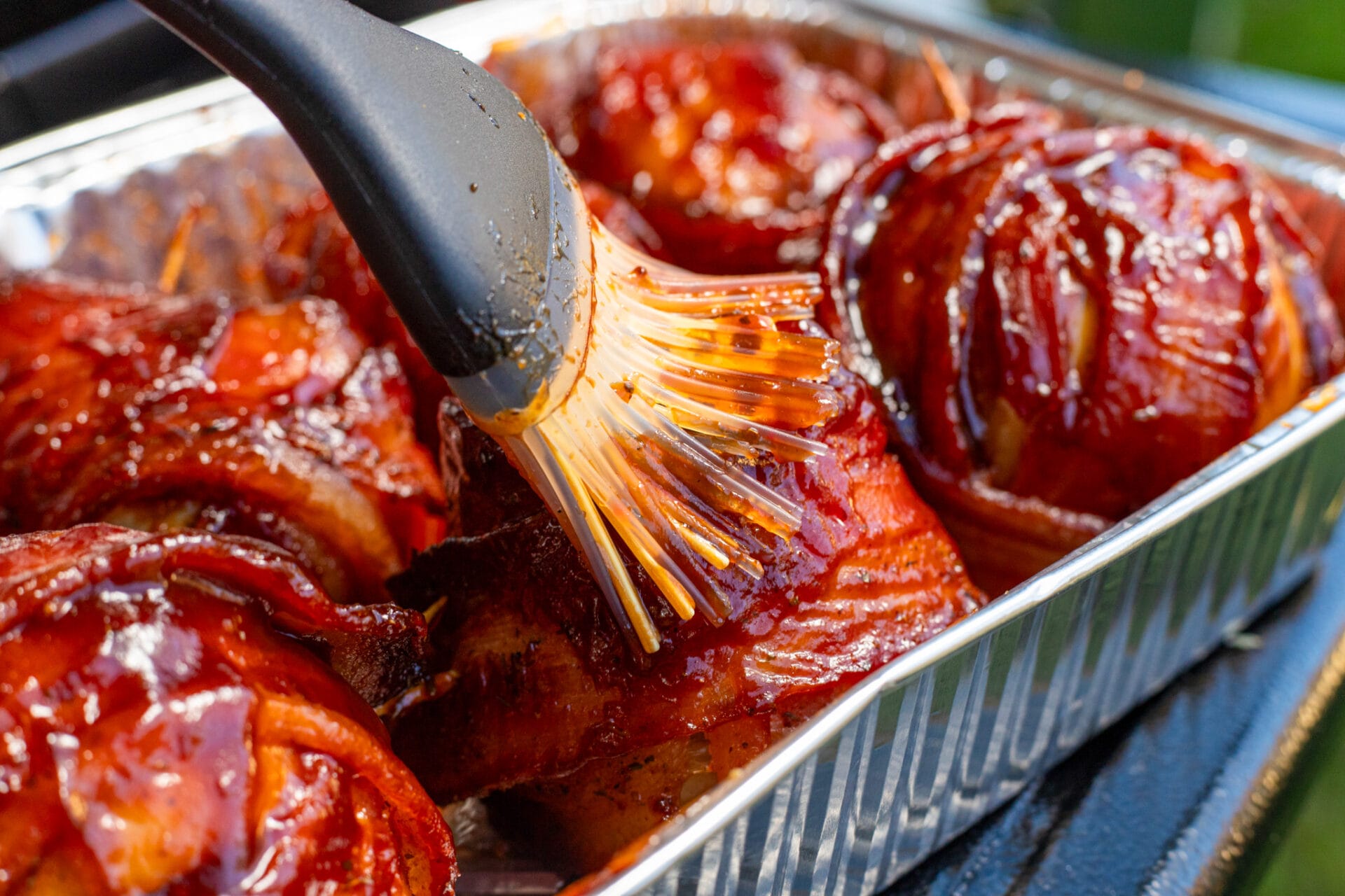 glazing-smoked-onion-bombs-on-pit-boss