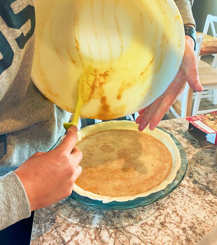 putting-pumpkin-in-pie-crust