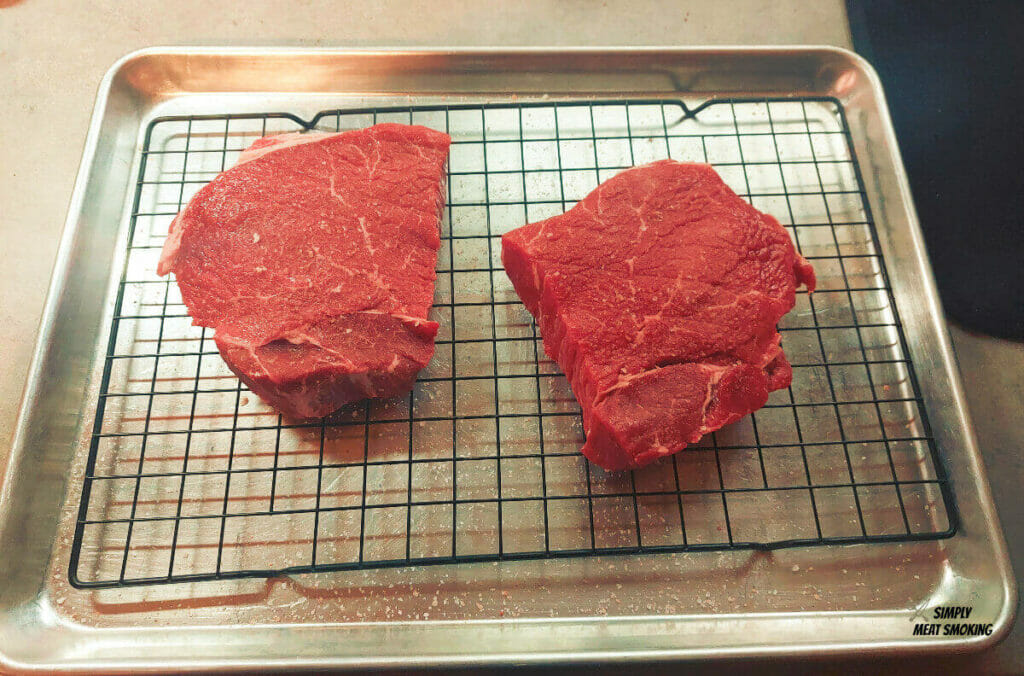 raw-sirloin-steak-about-to-put-rub-on-them
